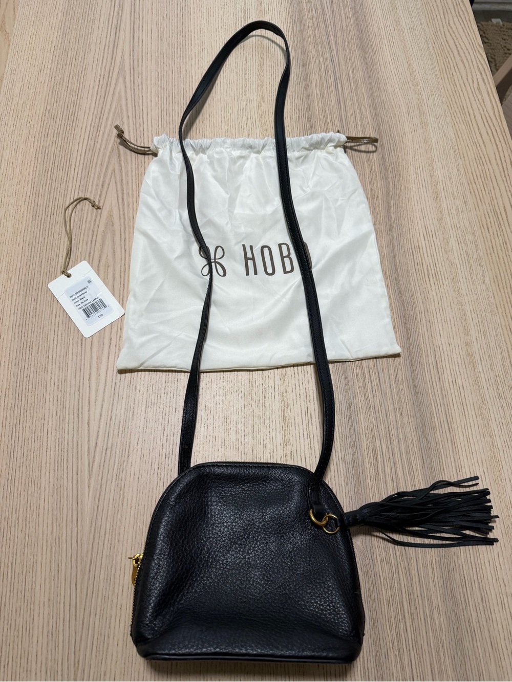 HOBO Nash in Black Pebbled Leather Crossbody with Tassel Accent